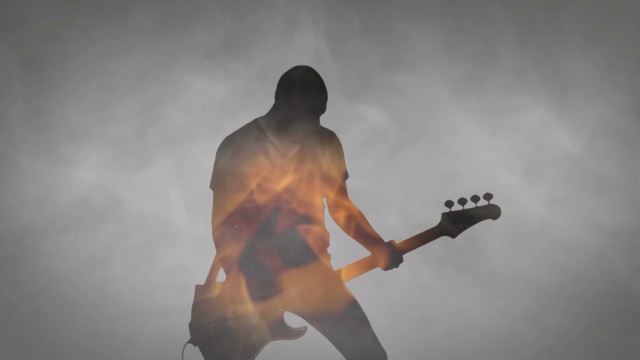 Rising Sun videoclip screenshot, bass on fire